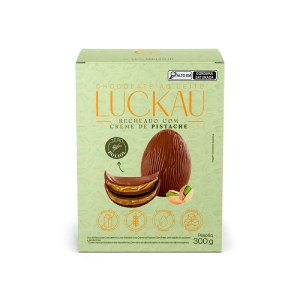Foto da embalagem do ovo de Páscoa trufado Luckau sabor chocolate ao leite com creme de pistache.
