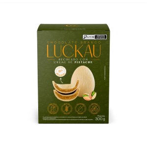 Foto da embalagem do ovo de Páscoa trufado Luckau sabor chocolate branco com creme de pistache.